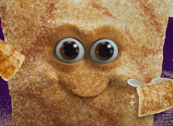 A creepy Cinnamon Toast Crunch face from a box that is CGI (not illustrated). It has intense eyes and a creepy smirk.